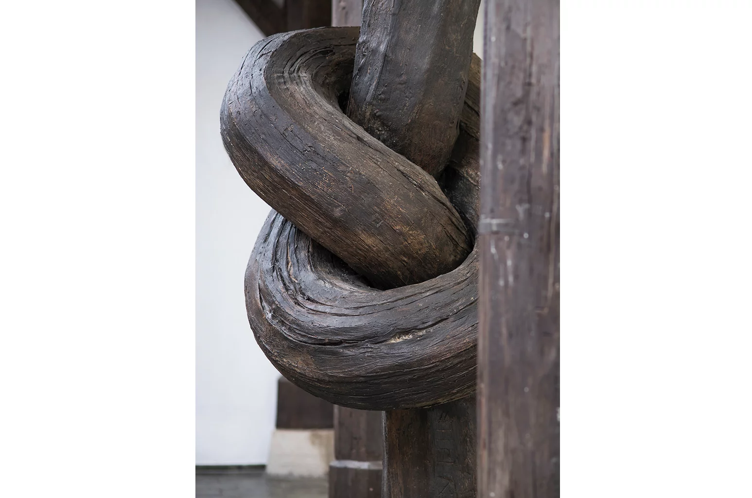 Birth, death and a midlife crisis slips a knotted, logic-defying wooden pillar into an old building