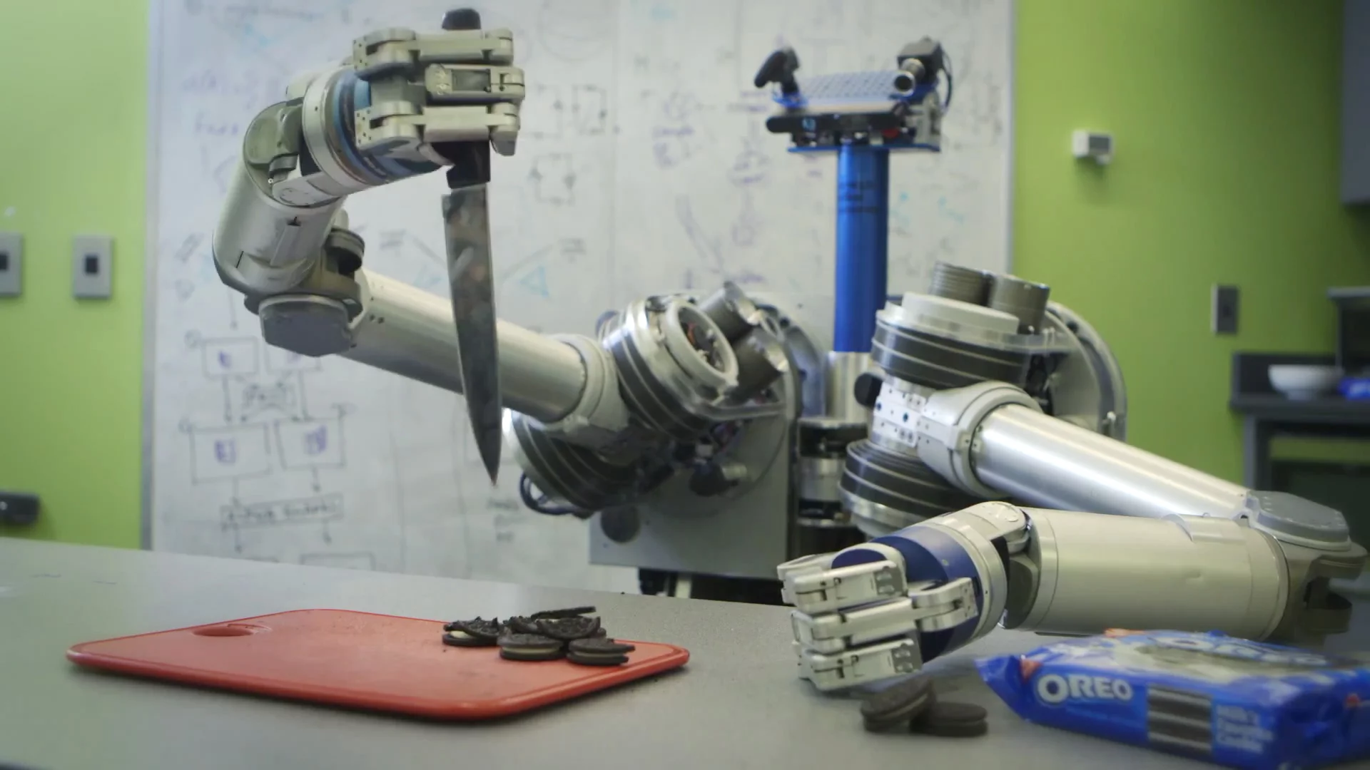 HERB brandishes a knife in a futile attempt to separate cookie from creme