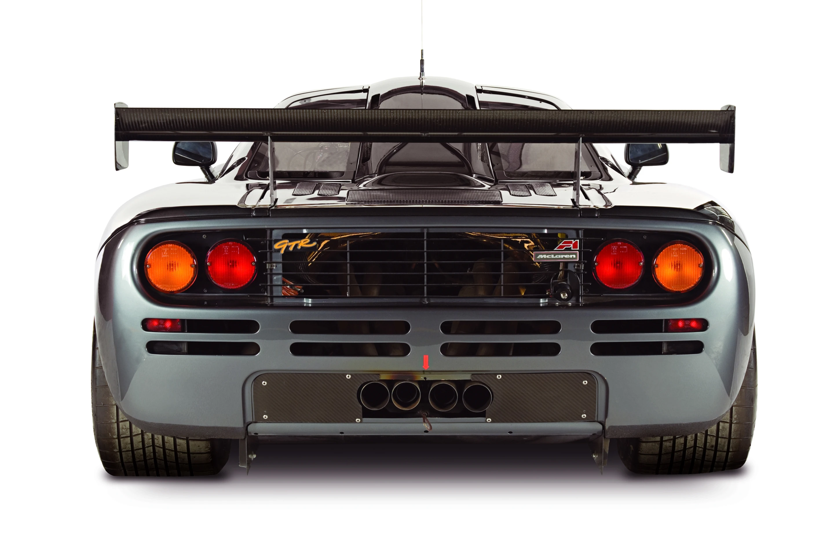 The F1 has no stock rear spoiler to assist with downforce so two Kevlar fans when activated suck air from underneath, effectively decreasing air pressure under the car and creating positive downforce
