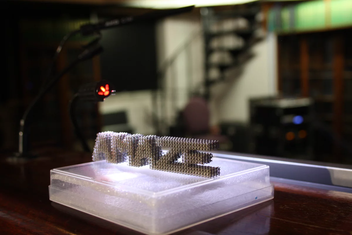 The AMAZE logo printed in metal using an additive manufacturing 3D printing technique that could be making its way to the ISS in the not too distant future (Photo: ESA-N. Vicente)