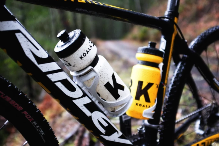 The Koala Bottle system uses magnets to hold its bottle in place on the user's bike