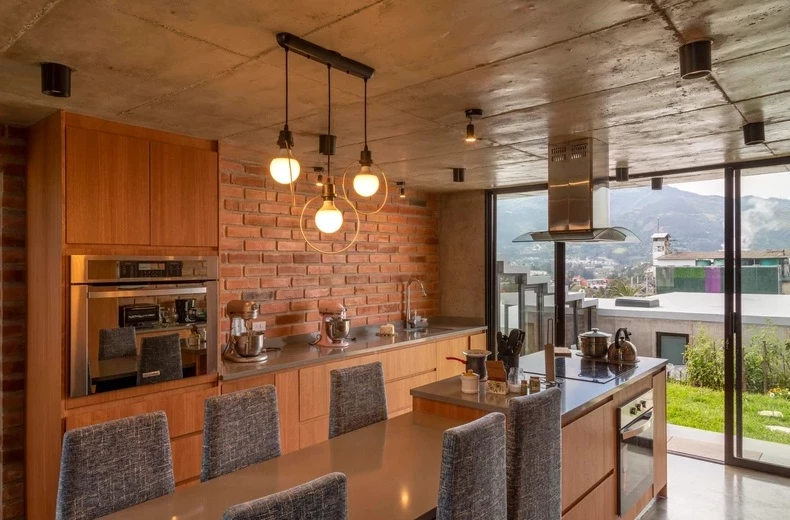 The kitchen, positioned in the heart of the home, brings the family together