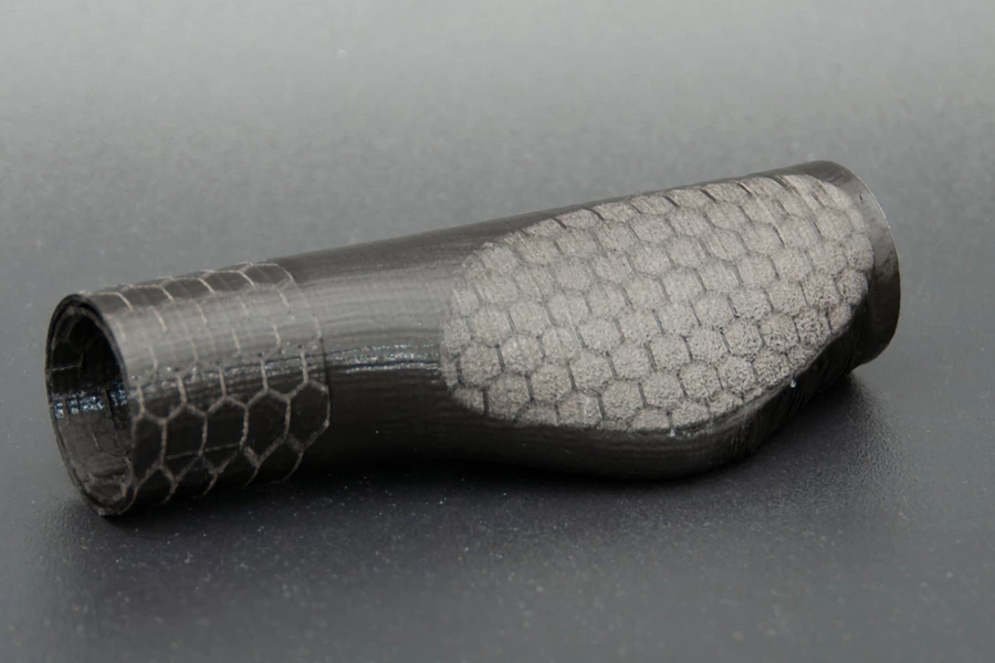 A bicycle grip which is rough and grippy where it needs to be, that was printed using the new technology