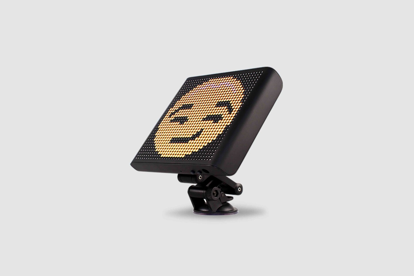 The Mojipic attaches via suction-cups to the car window, but can also be attached to the dashboard