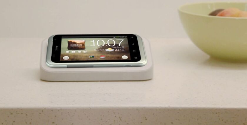 The HTC Rhyme docking station provides charging and doubles as an alarm clock and a music center utilizing its built-in speakers