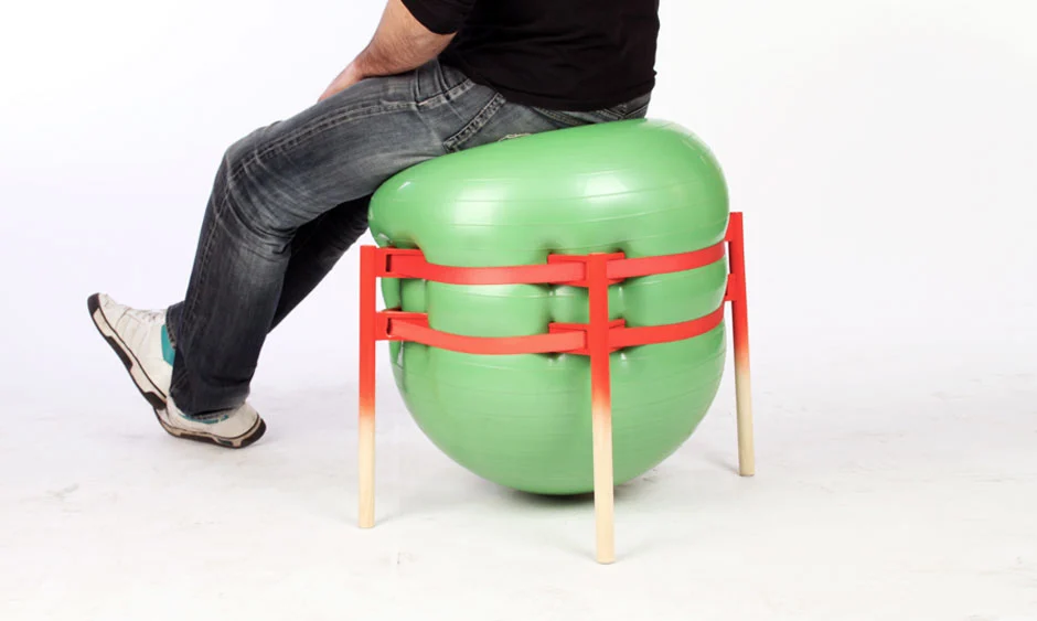 A yoga ball looks to be a surprisingly good option as a temporary chair, with the legs providing stability