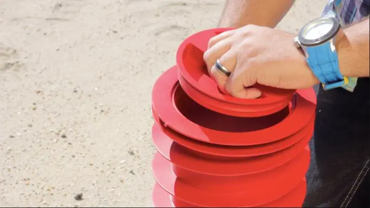 Beach Vault is cylindrical plastic container designed to secure your items underground and out of sight