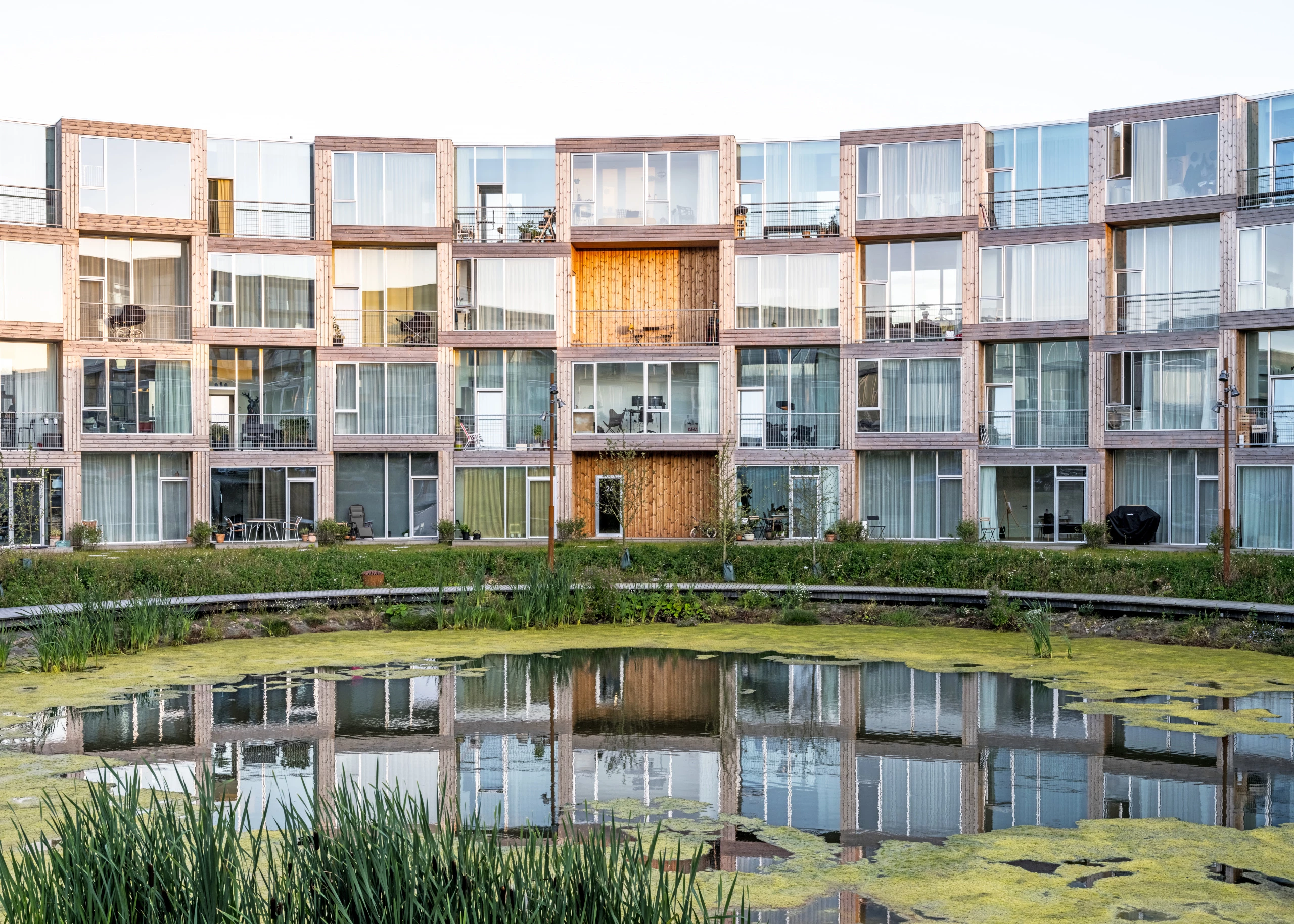 The Sneglehusene consists of 92 modular concrete homes which are stacked to create a checkered pattern