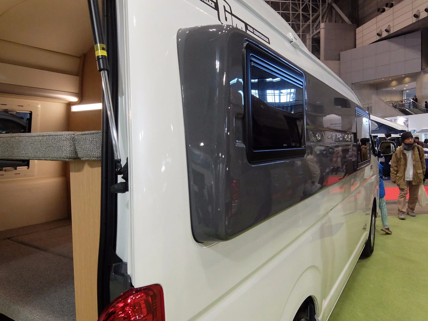 A neat way of increasing the interior space of this Class B van conversion was to fit special extended windows