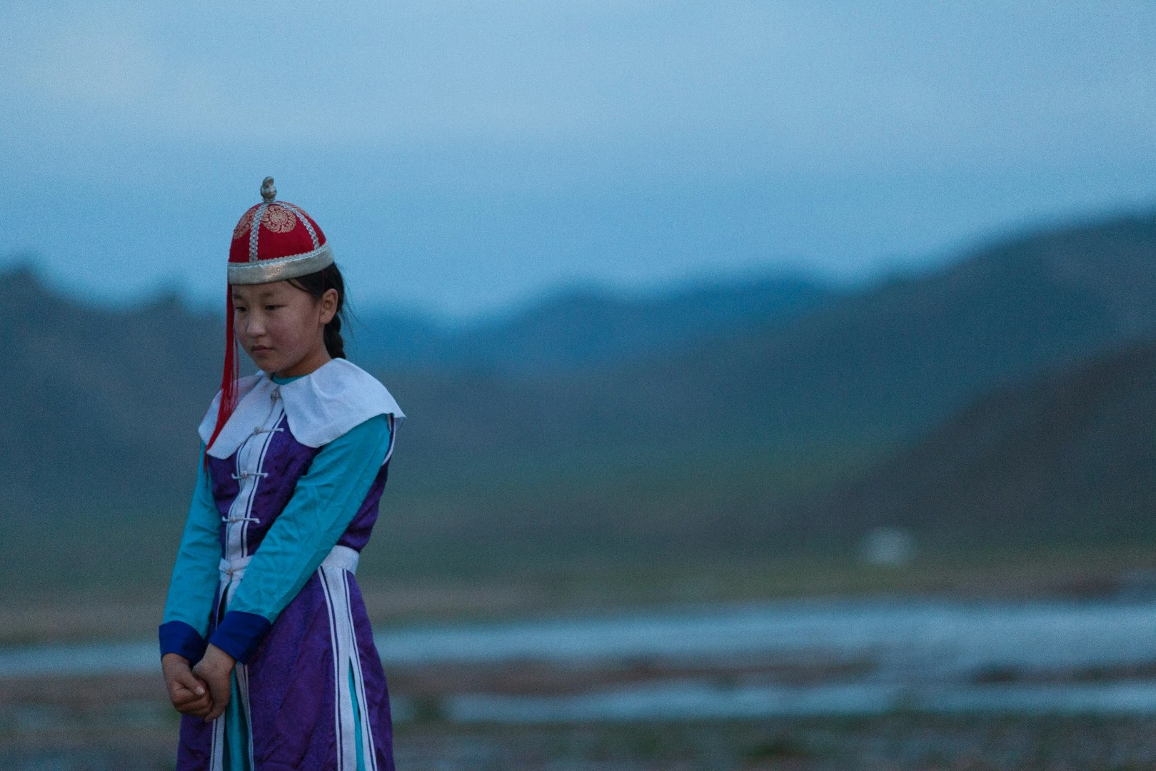 Young performer on the banks of the river outside Uliastai