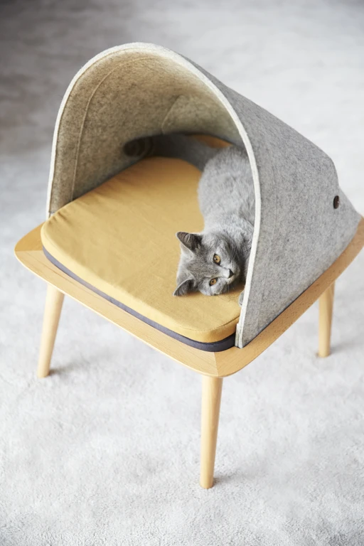 The Bed sports a different design and features a small table with a cotton cat dome atop