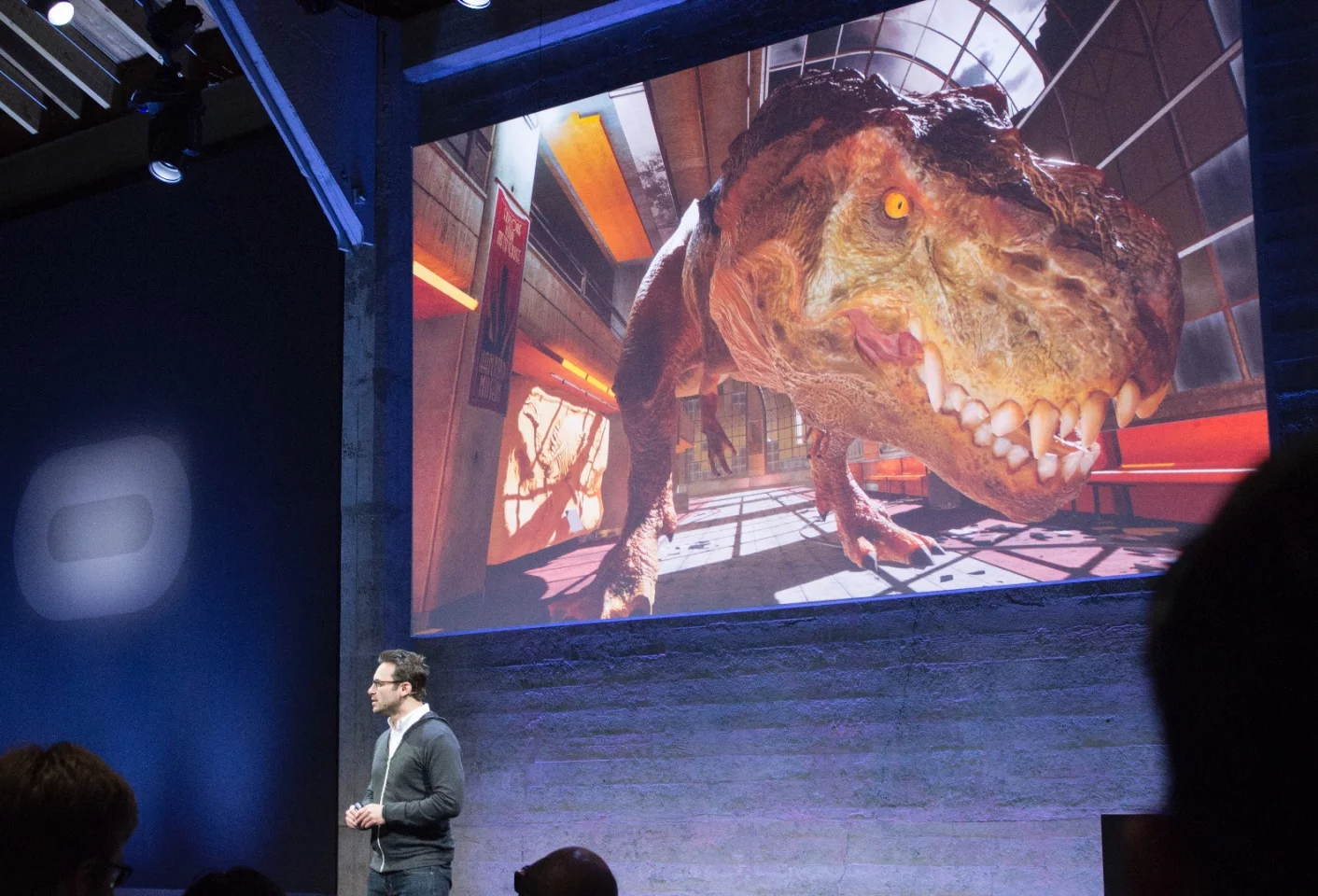CEO Brendan Iribe, articulating the difference between 2D content and virtual content – asking us to imagine a dinosaur breaking into the event's studio space