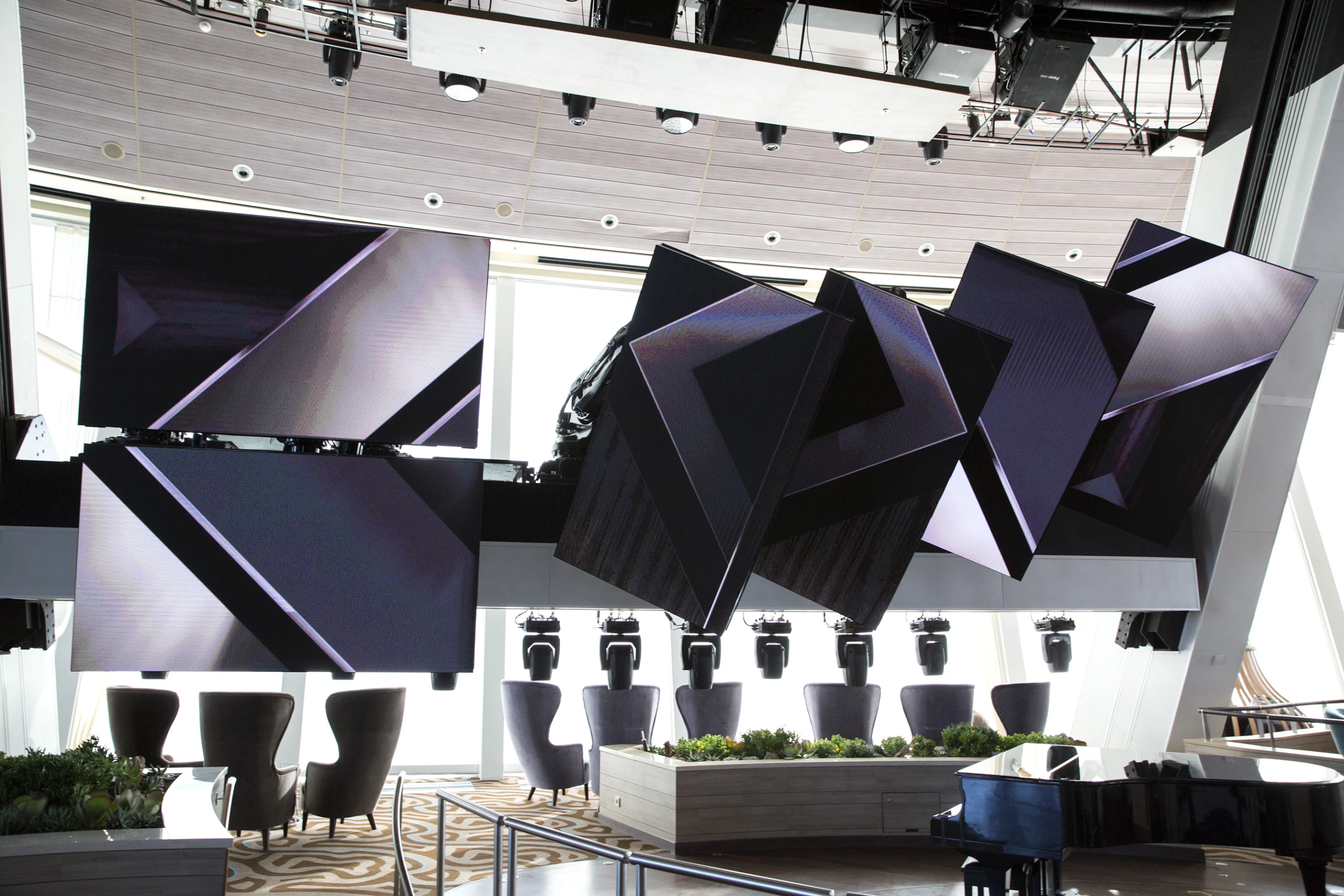 The RoboScreen entertainment system, created by Robotic Arts and featuring six ABB IRB 6620 robots mounted to an 8,200 kg (18,000 lb) capacity gantry with custom Daktronics screens fixed to them