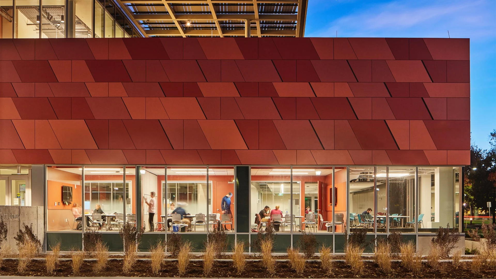 The Colorado College Tutt Library Expansion and Transformation's exterior cladding features red panels that reference locally mined red sandstone