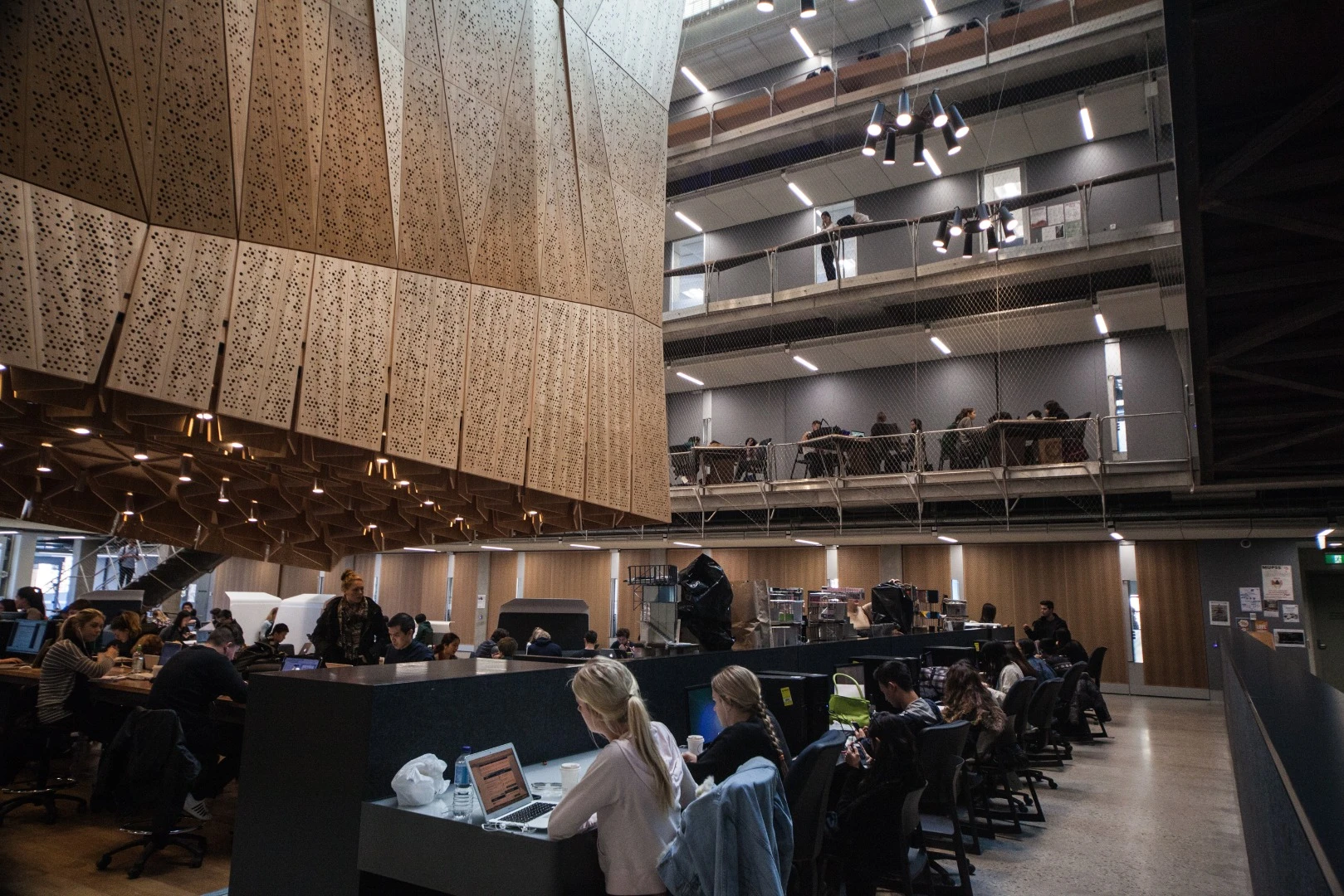 Up one level is where the studios and teaching spaces begin, but rather than lonely corridors and closed stairwells, the floor opens up to a mammoth four-story atrium bathed in natural light