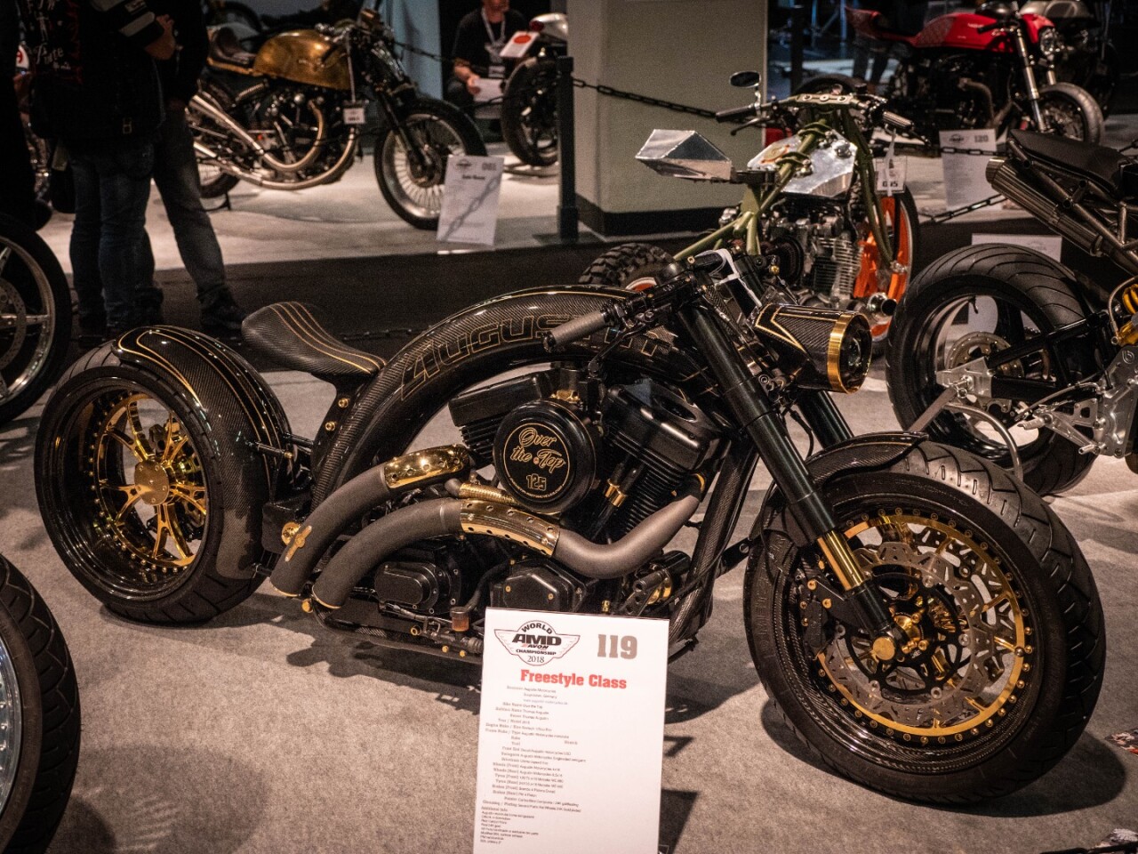Dear lord, those proportions. That curved frame! Over the Top is an absolute beauty from Augustin Motorcycles in Germany, starting out with a Revtech modified 125 cubic inch Evo motor. Everything that looks like carbon fiber is, and everything that looks like gold is, too. The overall effect is absolutely gob-stopping.