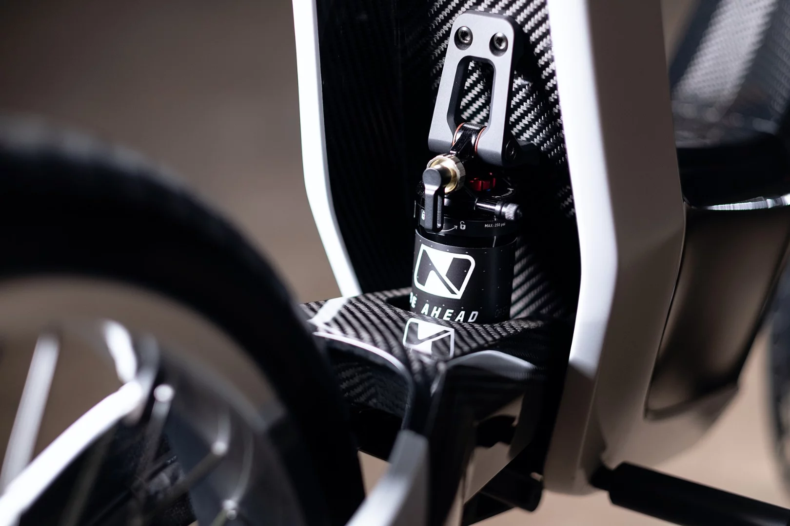 Adjustable rear shock hides away tidily at the back