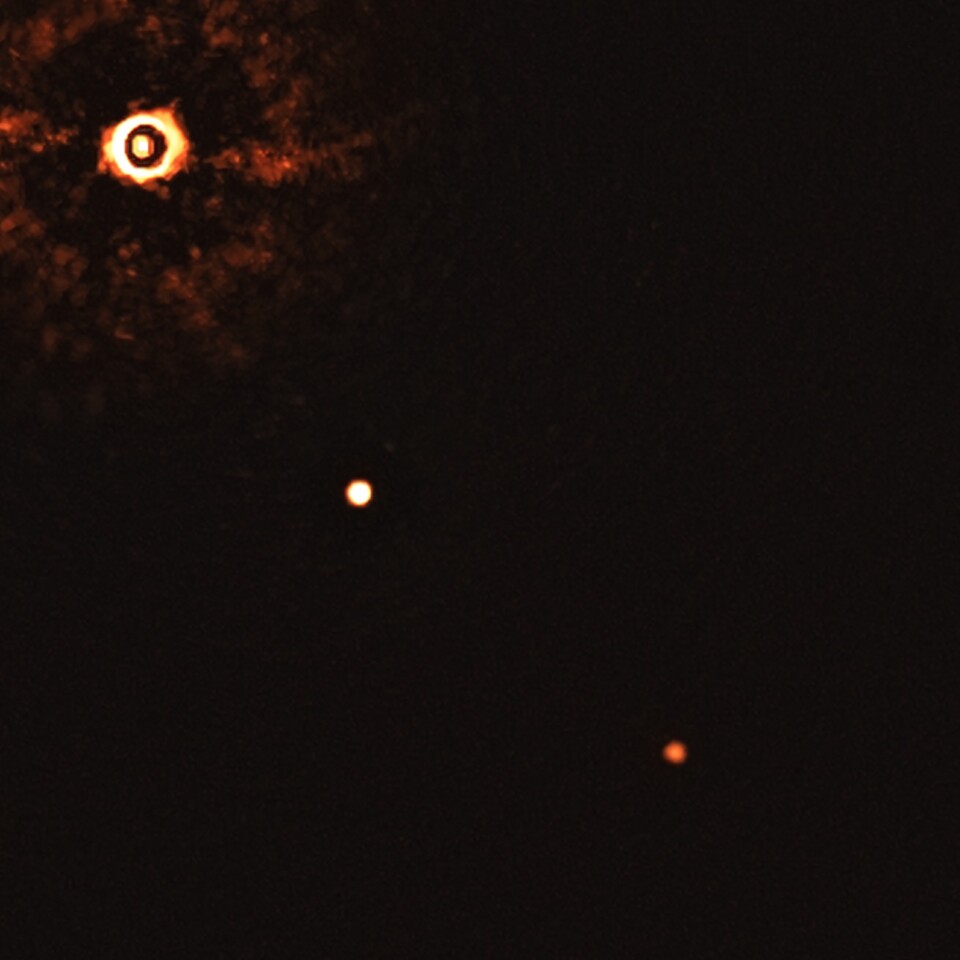 The VLT image of the Sun-like star TYC 8998-760-1 (top left), orbited by two giant exoplanets clearly visible as dots of light