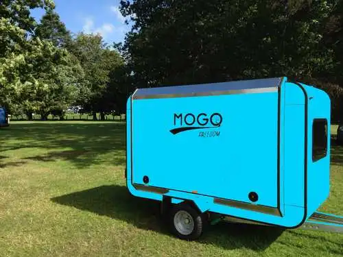 Mogo Freedom shows its trailer in various bright, lively colors