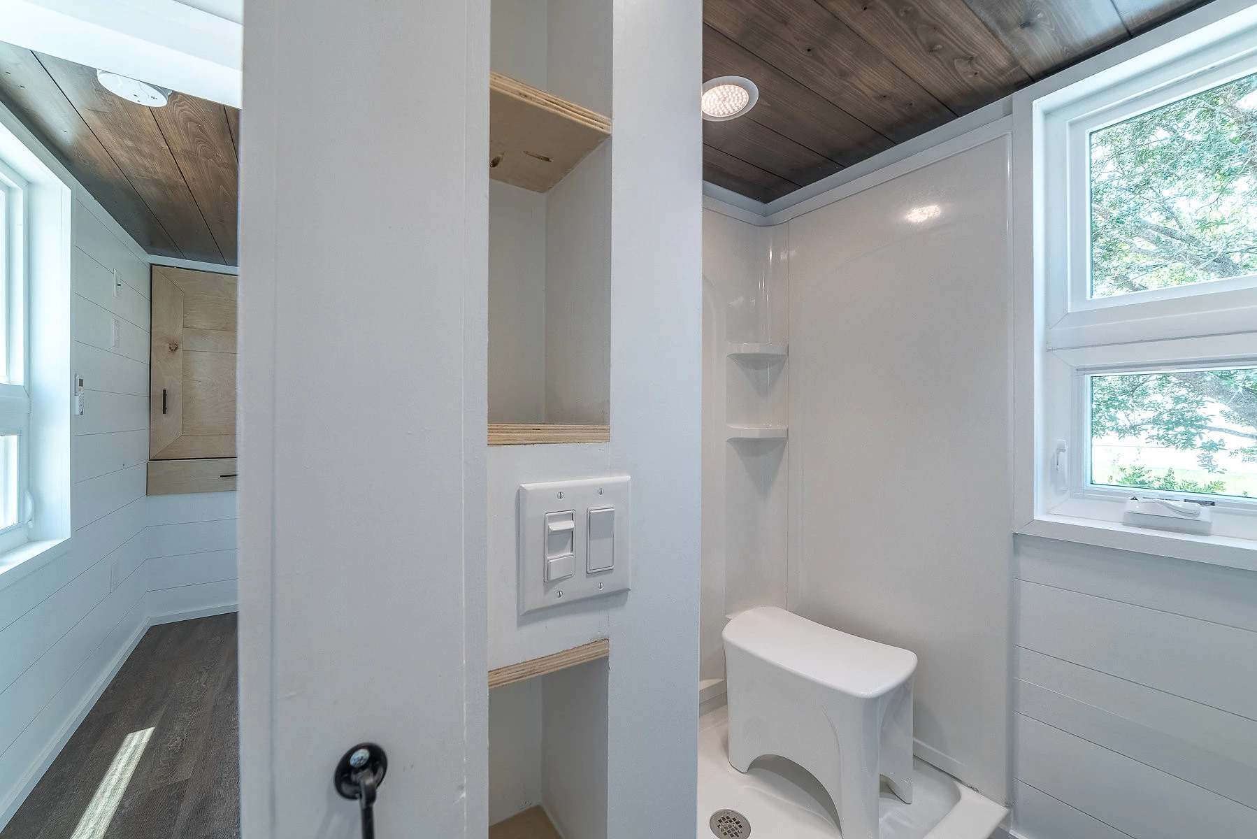 Plenty of room in this walk-in shower. Movable Roots used every bit of space by uncluding pocket shelves in the wall