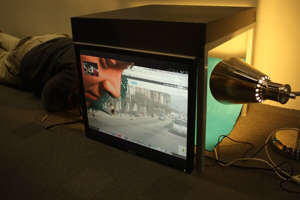 With Portal boxes, two people connected to the internet can literally reach behind a screen to interact with the virtual world inside together