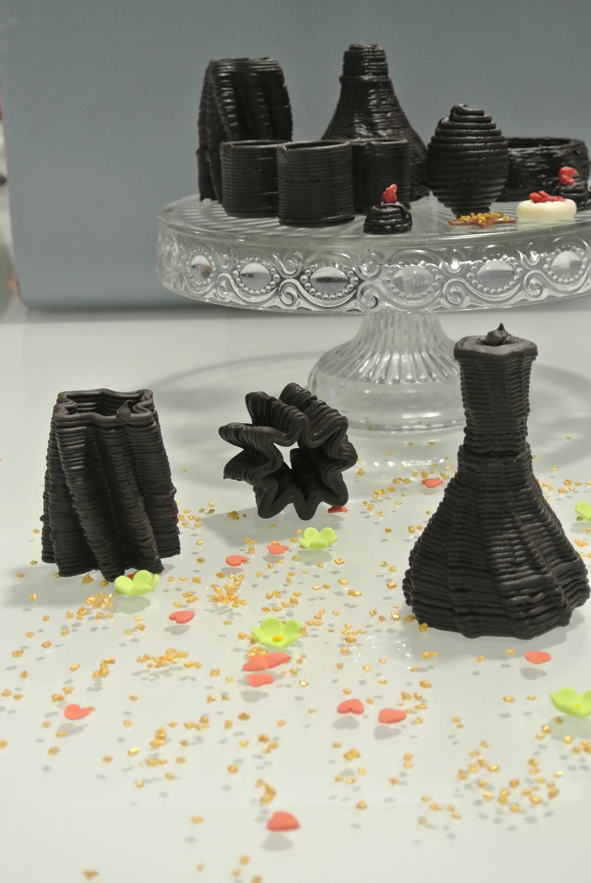 A selection of printed chocolates, some that could be used for holding drinks or desserts