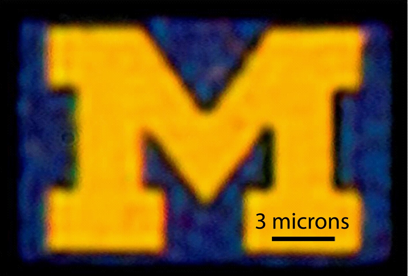 An optical microscopy image of a 12-by-9-micron U-M logo produced with this new color filter process