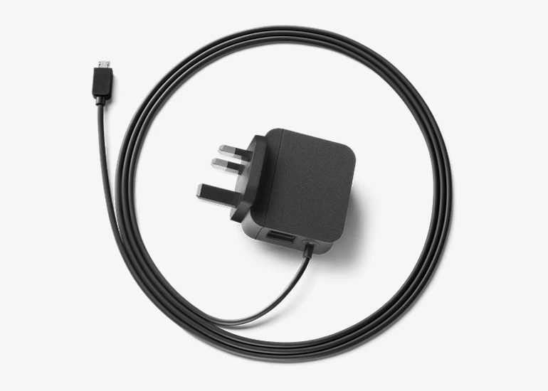 The adapter plugs into a spare power outlet