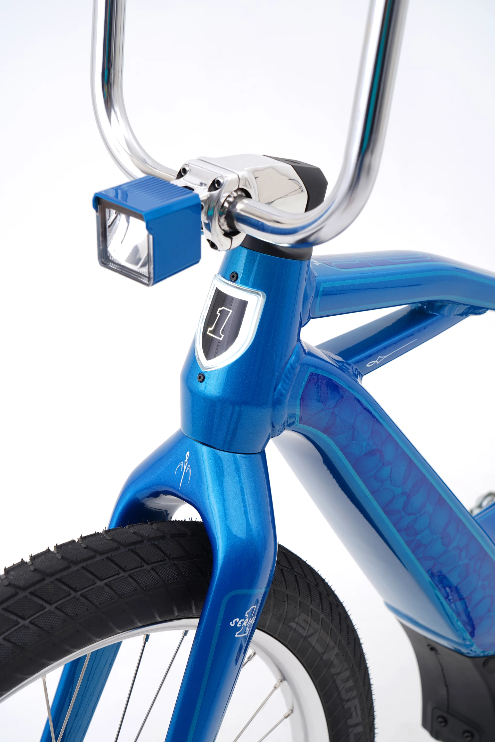 The ebike wears the brand's illuminated logo on the head tube, and custom paintwork throughout