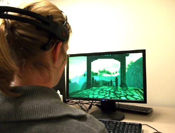 You can use something like the Emotiv BCI to play videogames. But can someone else use it to play you? Image: Martinovic et al.