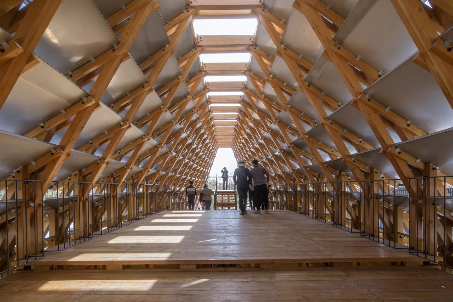 The Timber Bridge in Gulou Waterfront is topped by skylights to maximize natural light inside, though it does also have lighting installed for nighttime use