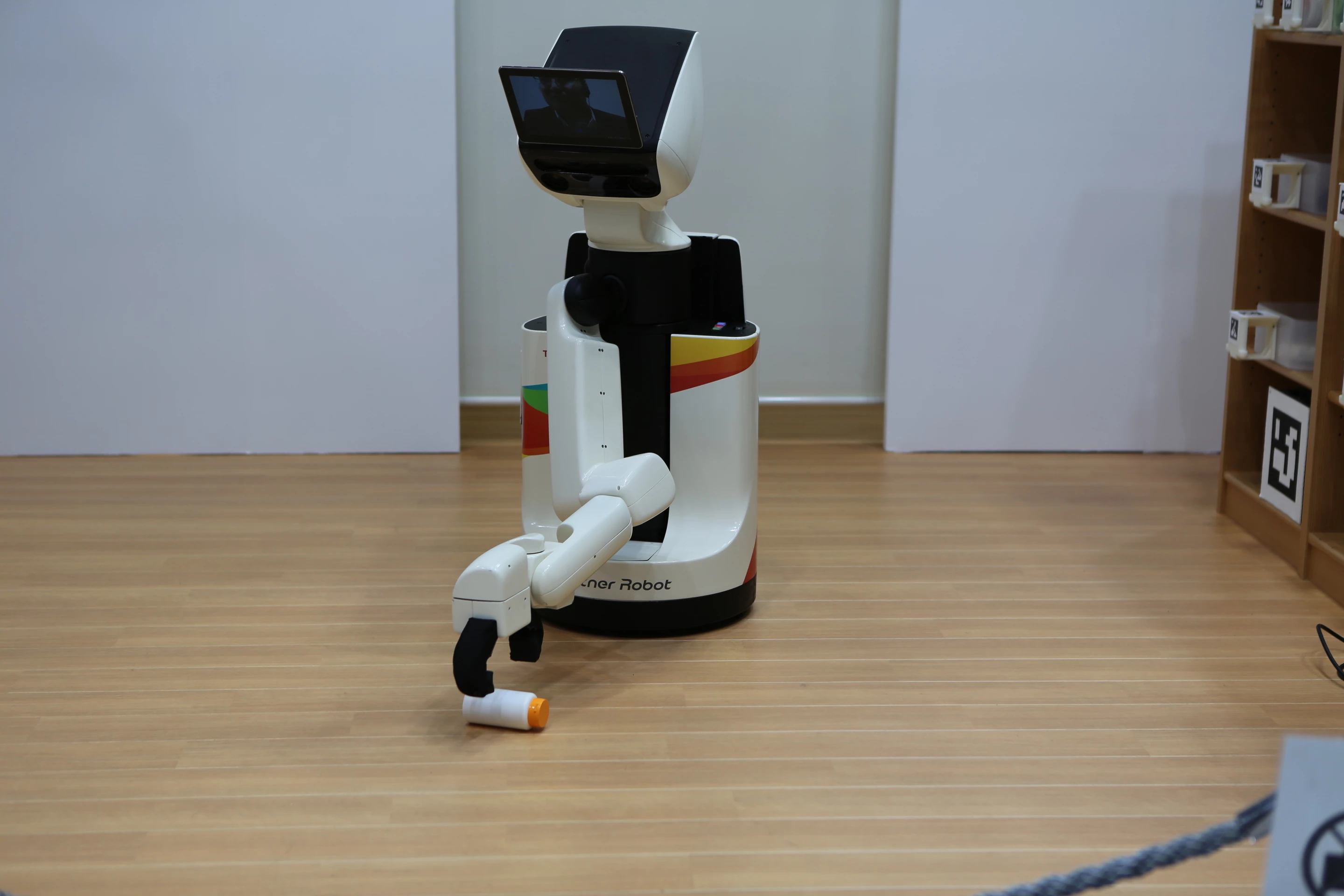 Using its 3D cameras, object recognition, and gripper, Toyota's Human Support Robot can retrieve fallen objects from the floor (Photo: Mike Hanlon, Gizmag)
