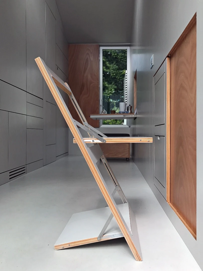 aVOID's folding chairs are really neat and slot into the wall