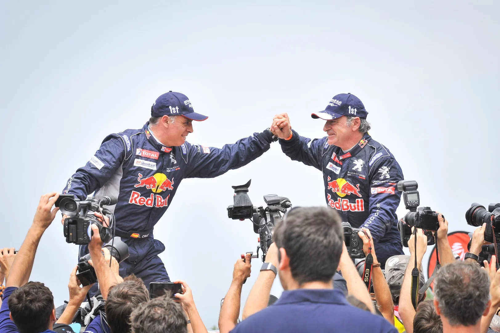 Carlos Sainz and Lucas Cruz celebrate their hard-fought win in the car division