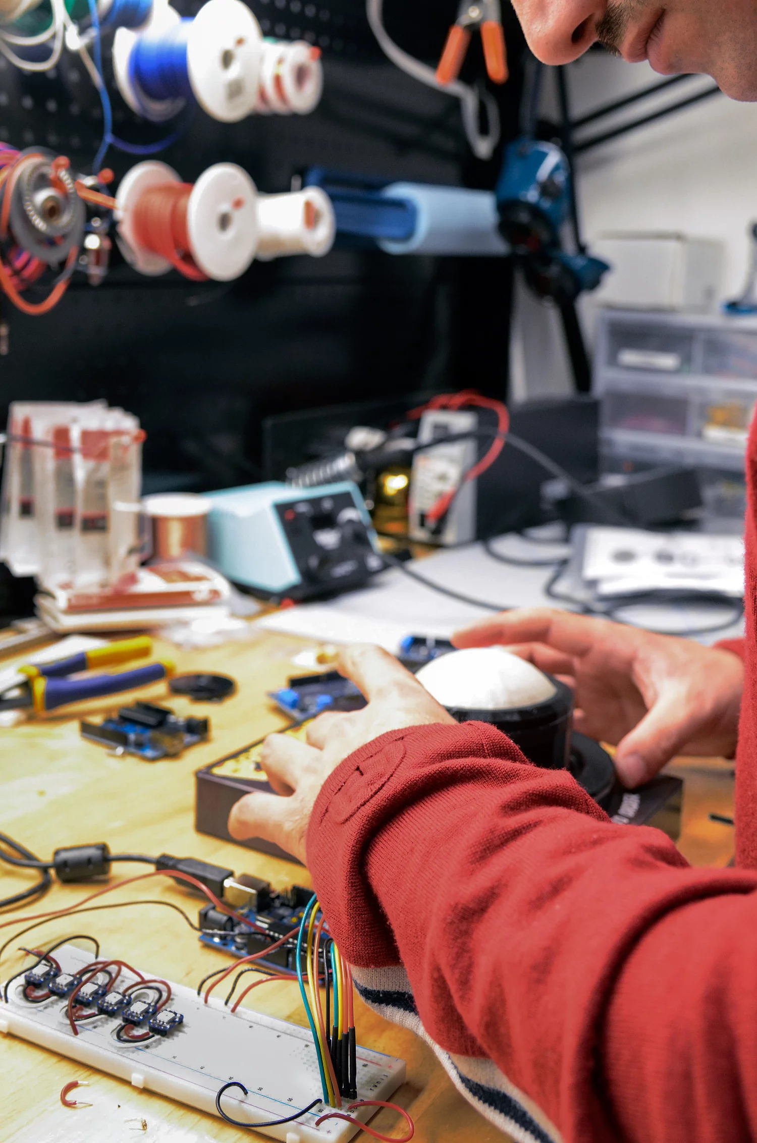 The whole device is run by a Raspberry Pi using a custom JavaScript program specifically tailored to Domino's online service