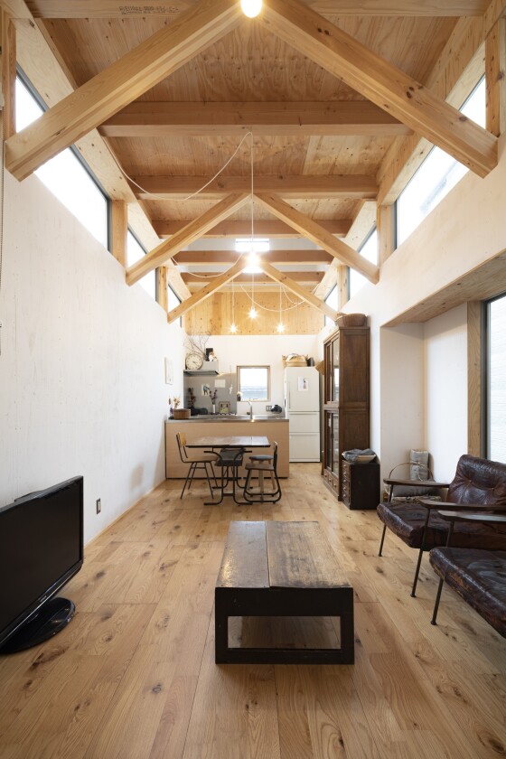 House in Osaka's second floor features its living and dining room, as well as a small kitchen