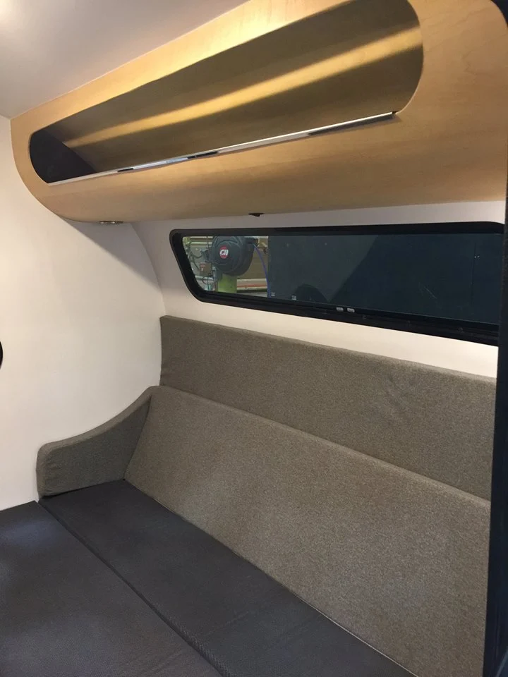 The Bean mattress can slid up to double as a sofa for relaxing and working