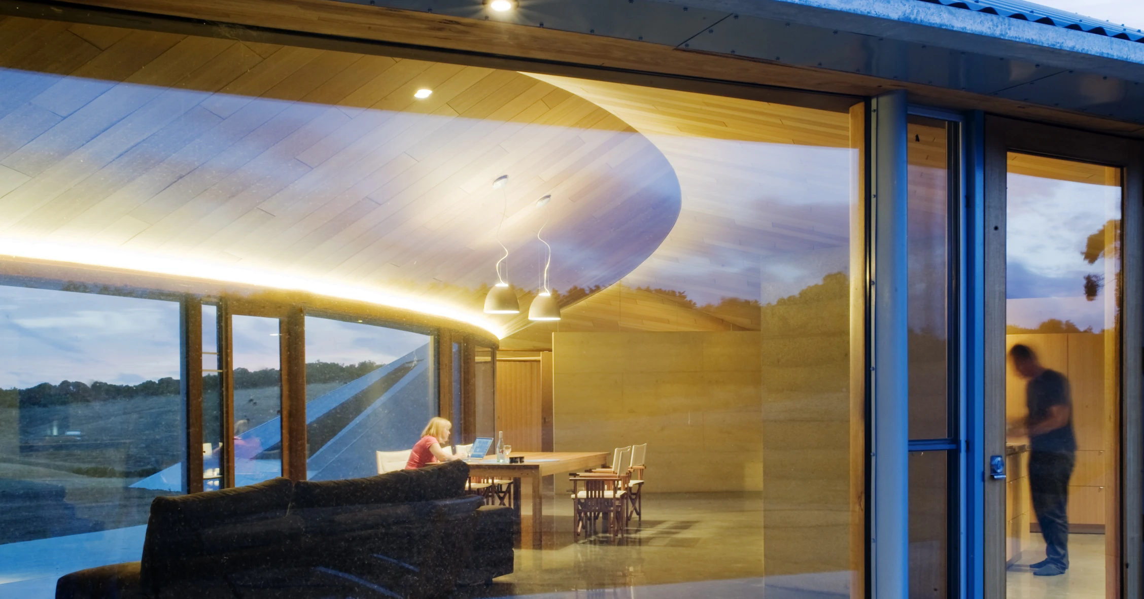 The home’s modern and simple finishes include enormous double glazed floor-to-ceiling glass windows