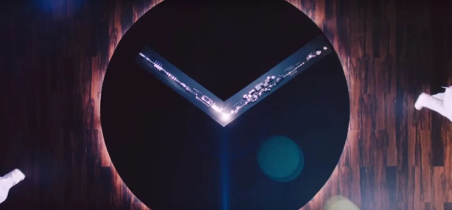 The machine/town forms the hands of a watch face