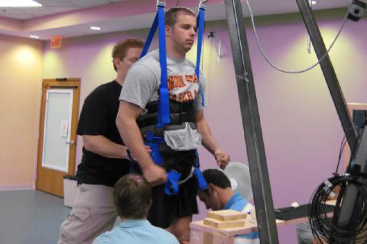 Rob Summers, 25, in the harness that provides support while he receives electrical stimulation to his spinal cord (Image: Rob Summers)