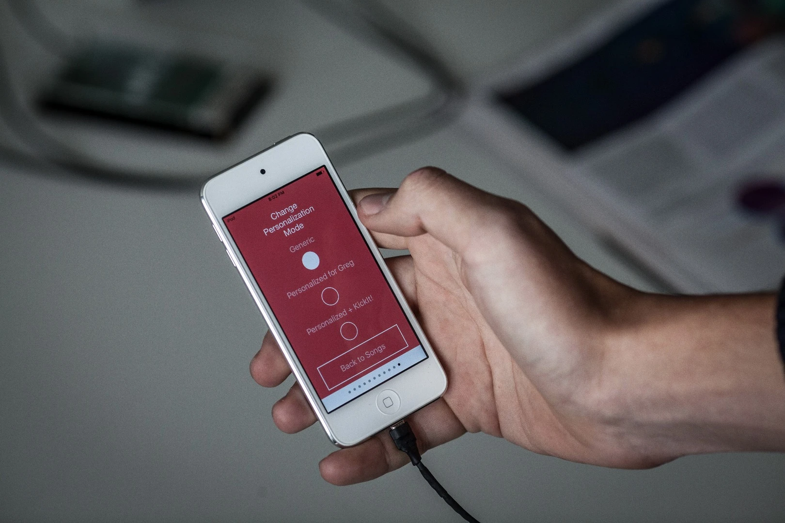 The prototype Nura training app lets you choose between a flat mix, a personalized mix for your ears, or a mix with extra "Kickit!" bass