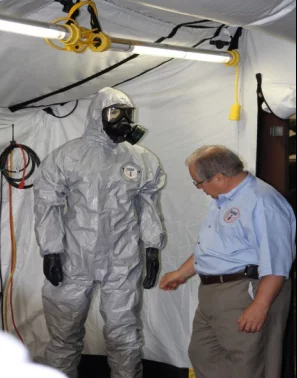 Tyvek coveralls and breathing apparatus are standard issue for FDHS technicians