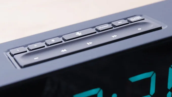 The buttons on top of the alarm clock