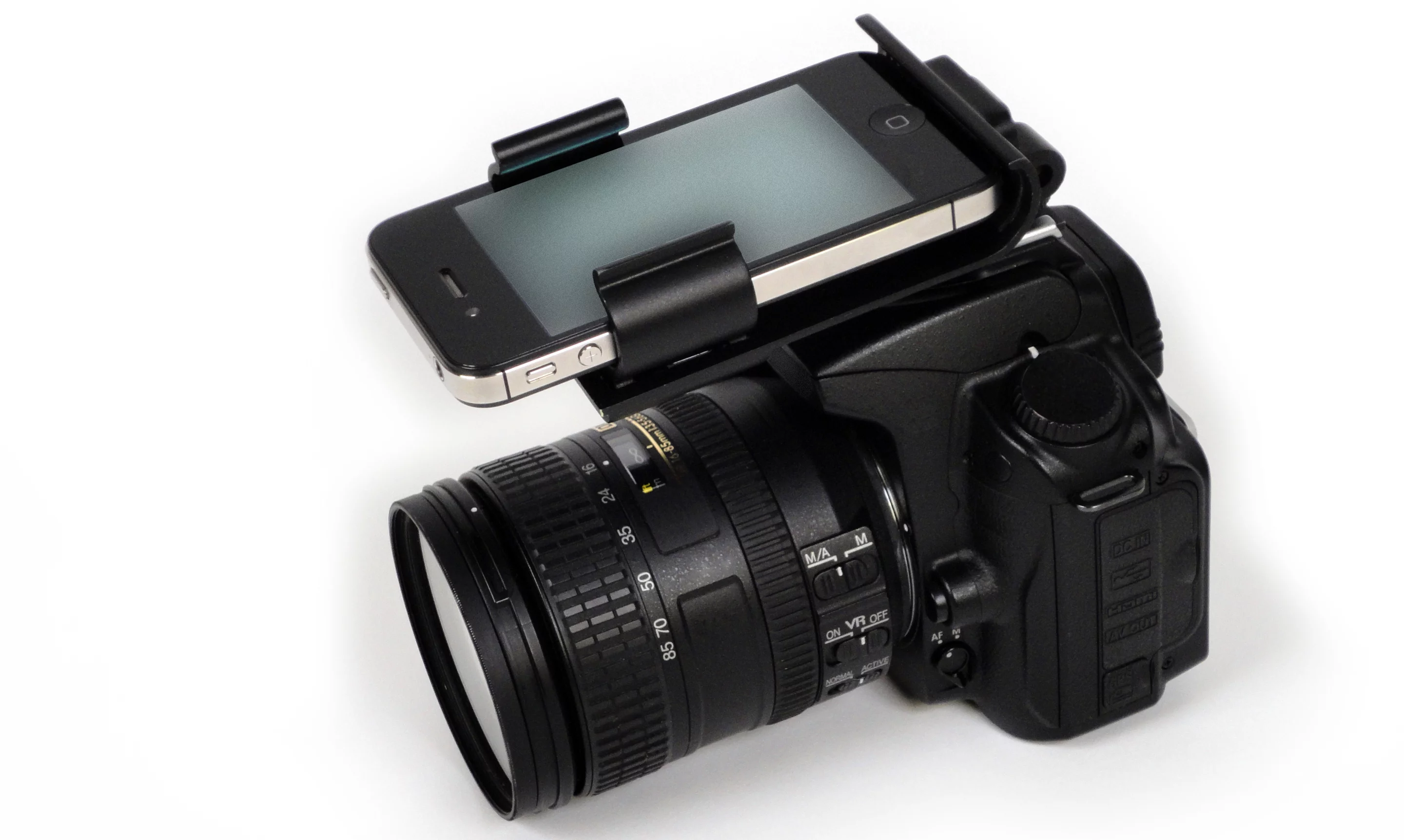 The Flash Dock from Pocket Demo provides a physical connection between your iPhone and DSLR camera via the latter's hot shoe socket, providing ready access to your library of photography apps