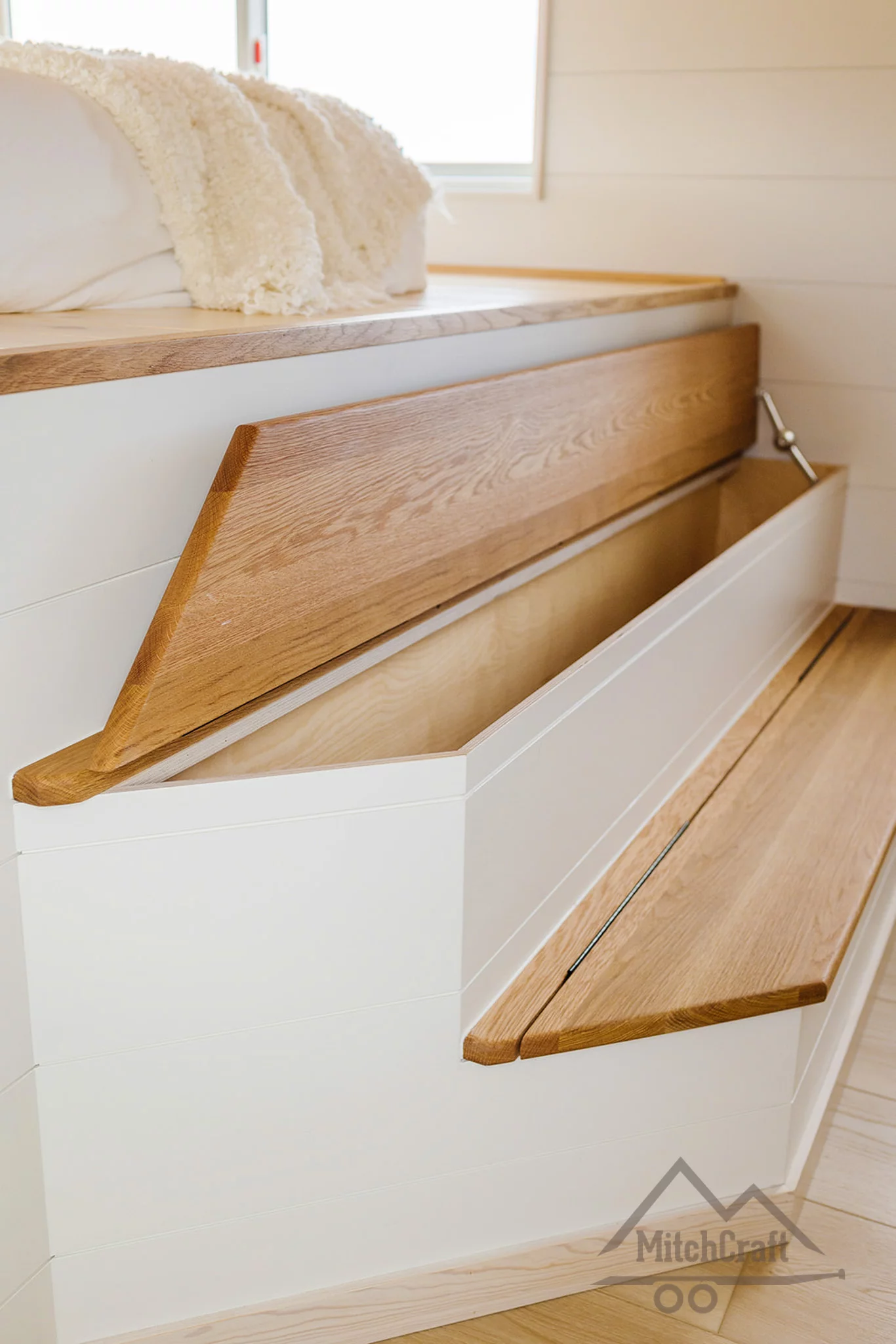 The CC 31' x 10' only has one bedroom, which is reached by storage-integrated steps