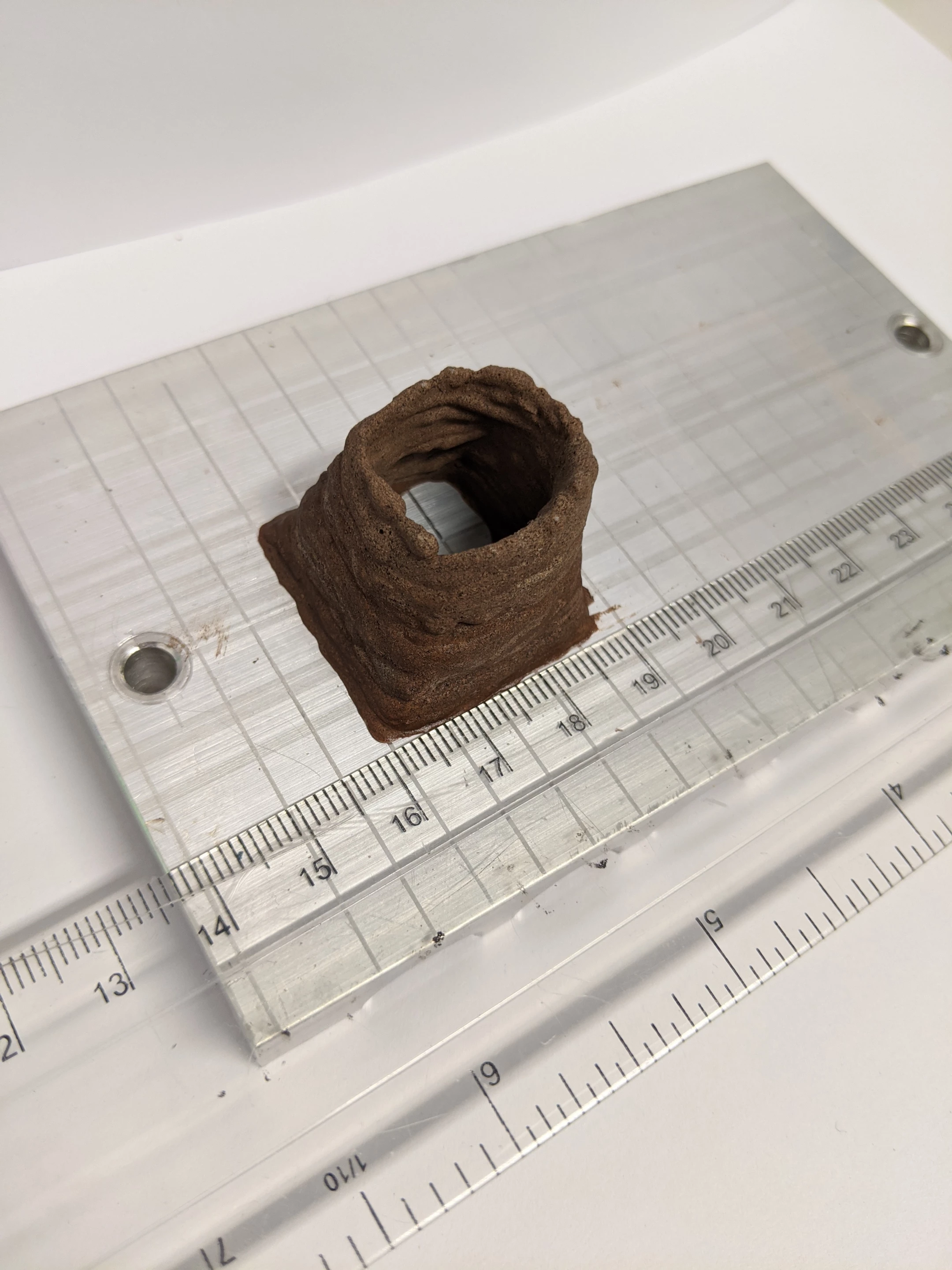 A small 3D-printed structure made with simulated Mars soil and products of the human body