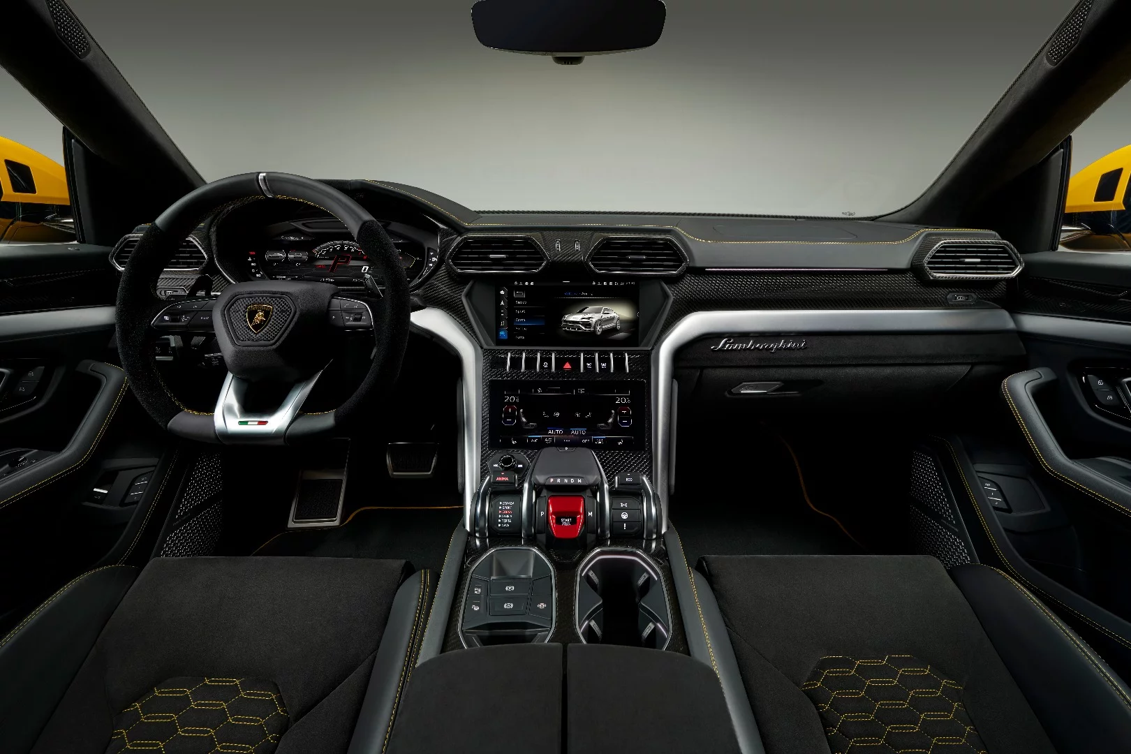 Elements found in current Lamborghini supercars are seen inside this SUV, starting with the Y-shaped dashboard and hexagonal theme throughout the cabin