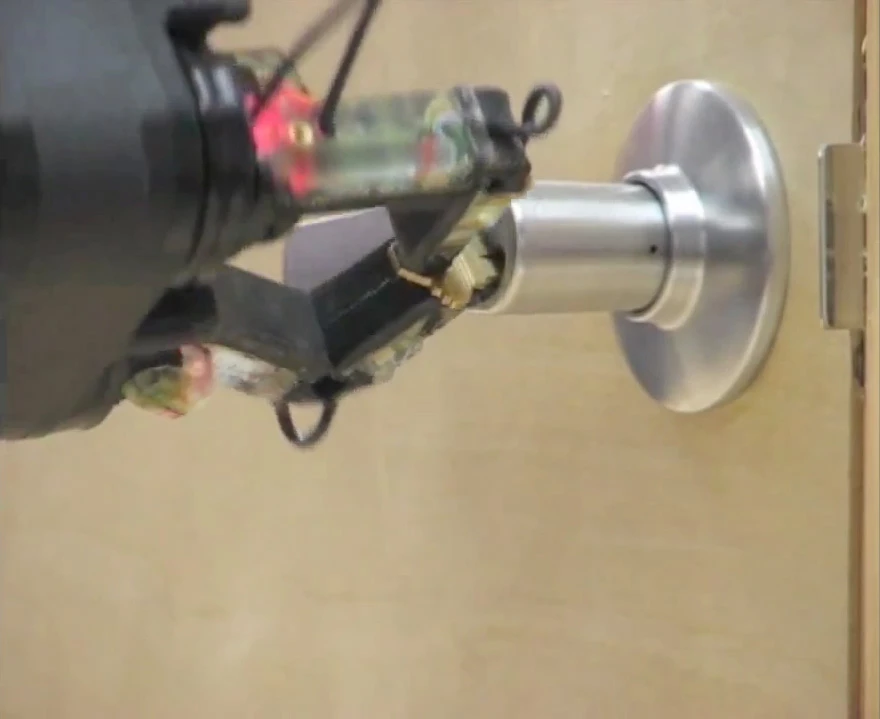 ...it inserts a key into a locked door and turns it (see next image)