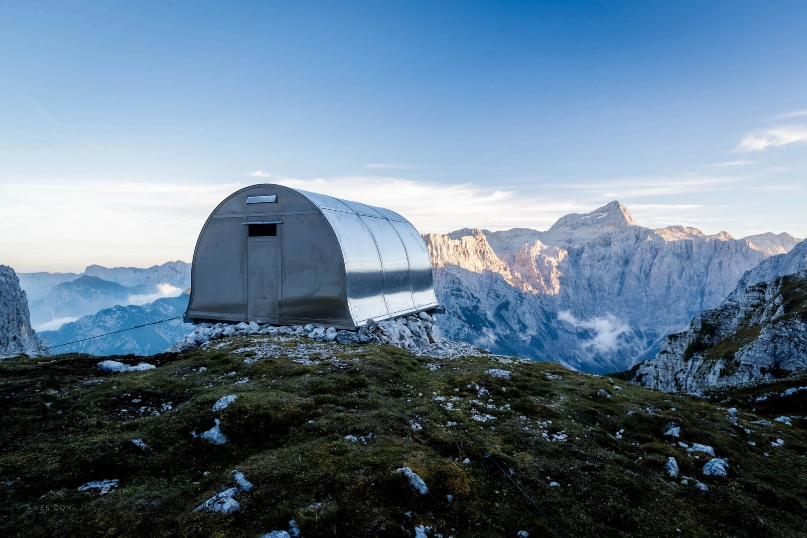 Bivak II na Jezerih was designed by architect Darko Bernik, who had help from local alpine club AO Jesenice, the Slovenian Armed Forces, and alpinist Anže Čokl to install it