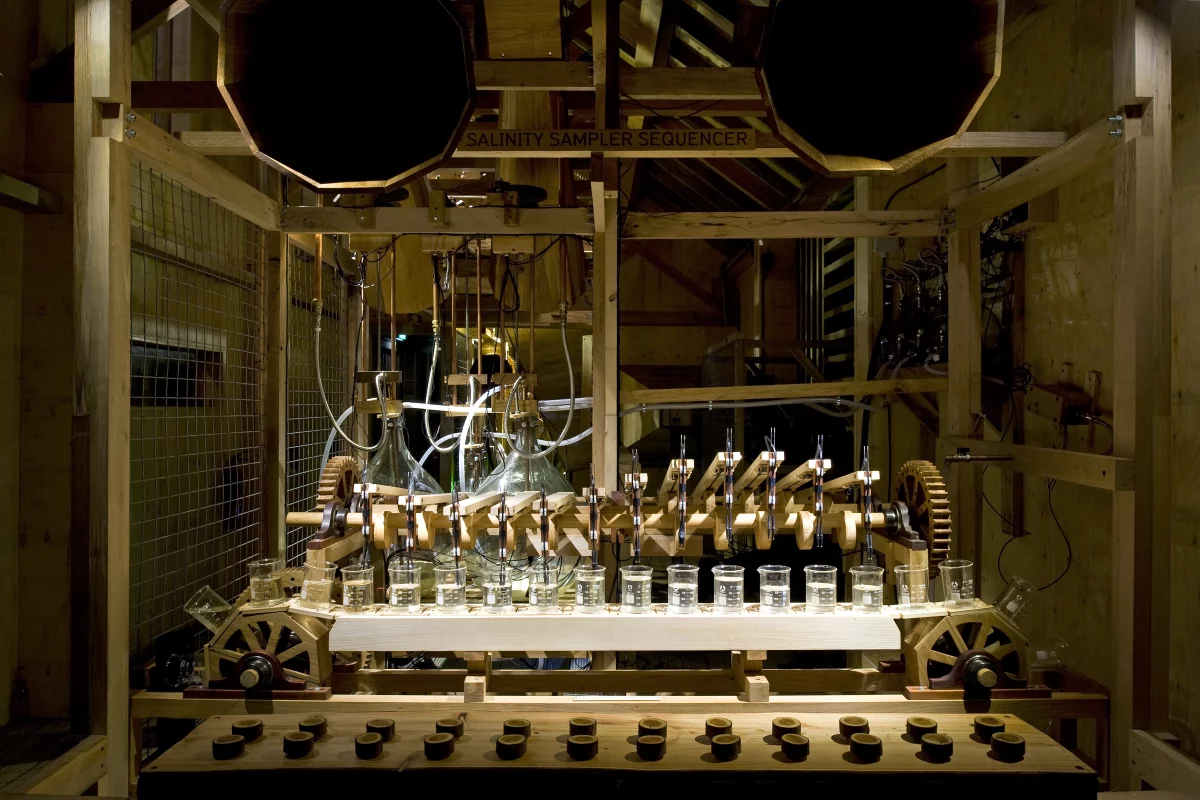 A (wonderfully named) Salinity Sampler Sequencer "plays" hourly river water samples with the assistance of a wooden conveyor belt and electronic sensors